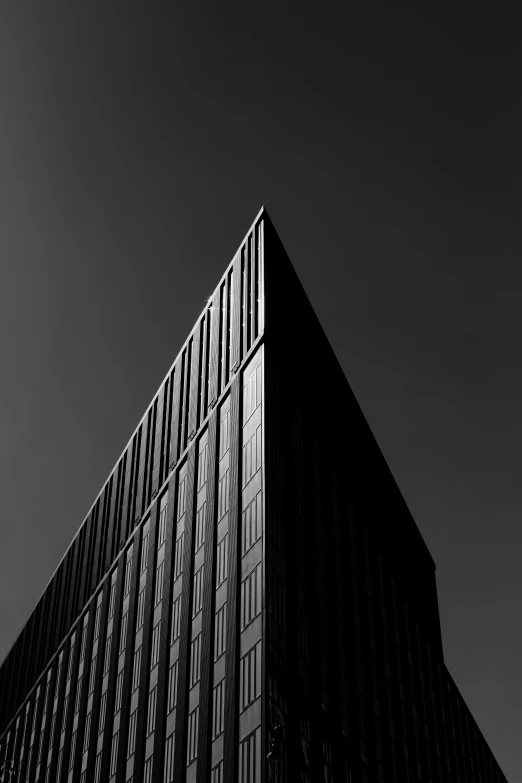 the top of a tall building under a black sky