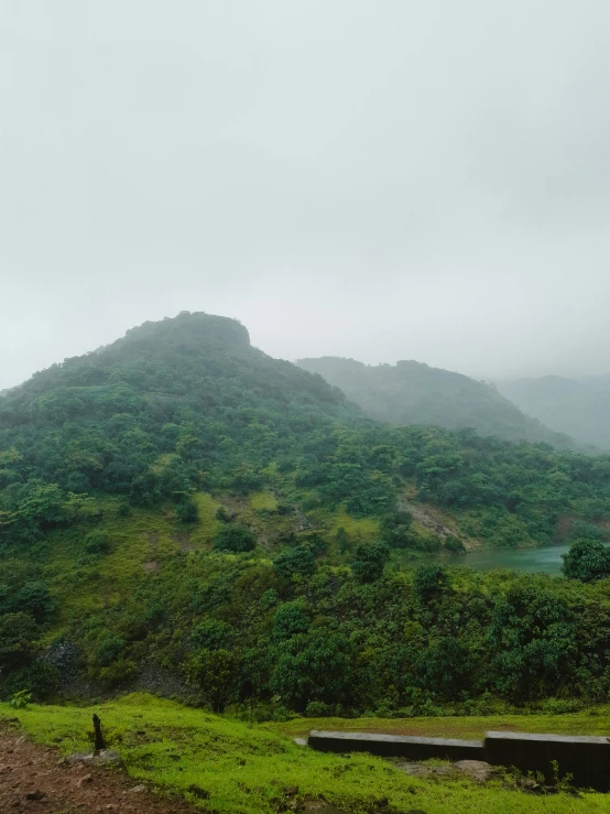 a bench overlooking a beautiful view of mountains