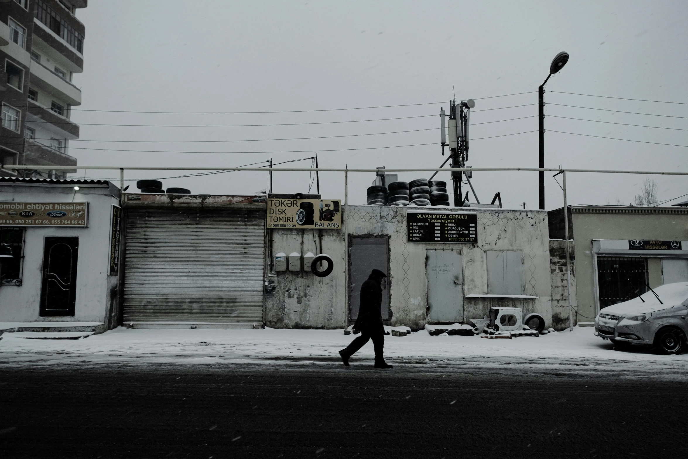 an old industrial building next to a street