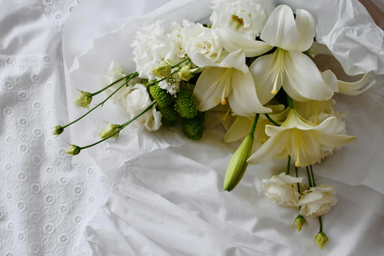 some white flowers on a piece of paper