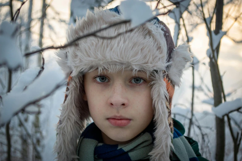 a  wearing a white hat and scarf