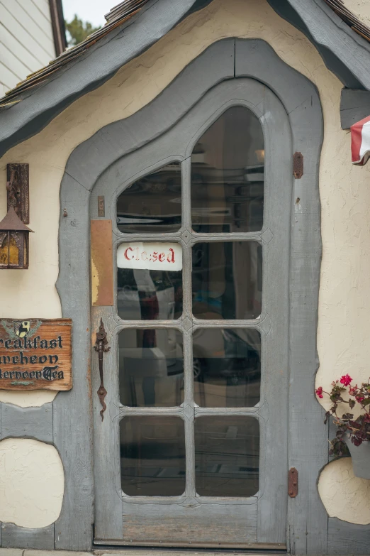 the front door to a house with an arched glass