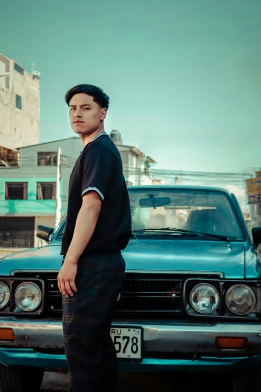 a man standing in front of a car