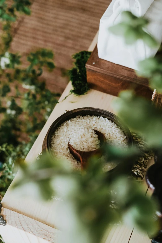 the food is in a bowl on top of a wooden board