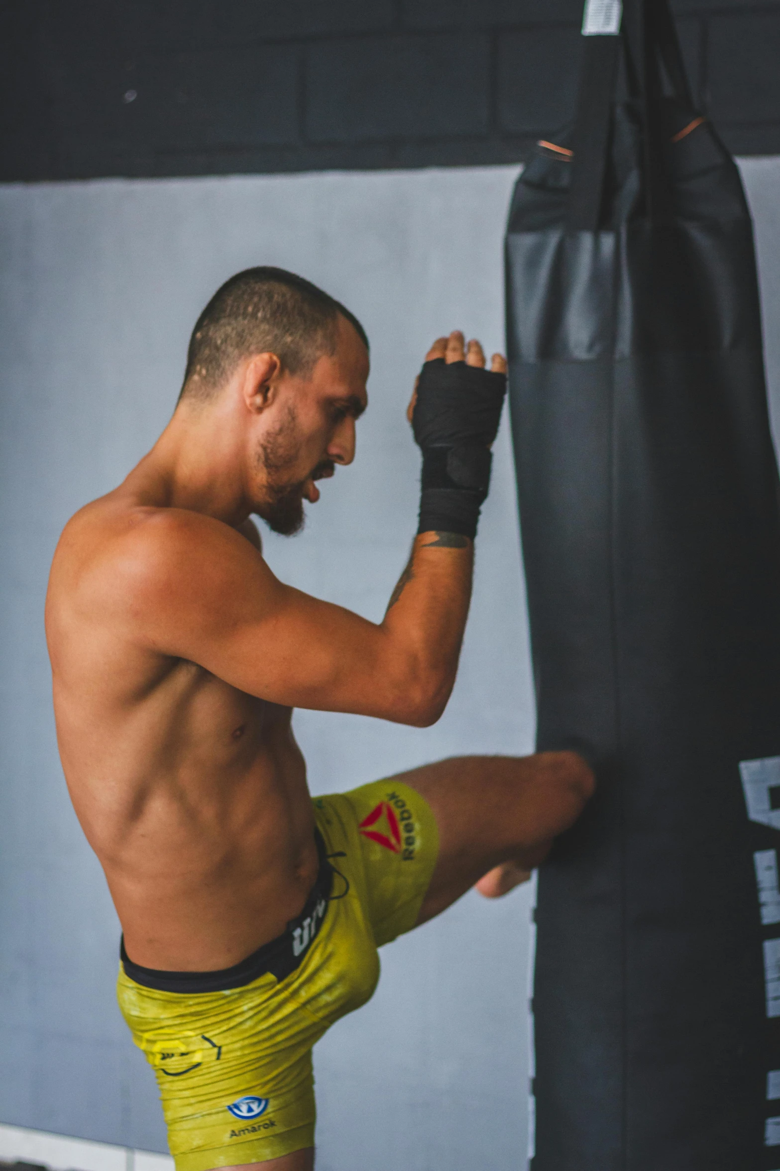 a man doing boxing exercises with a bag