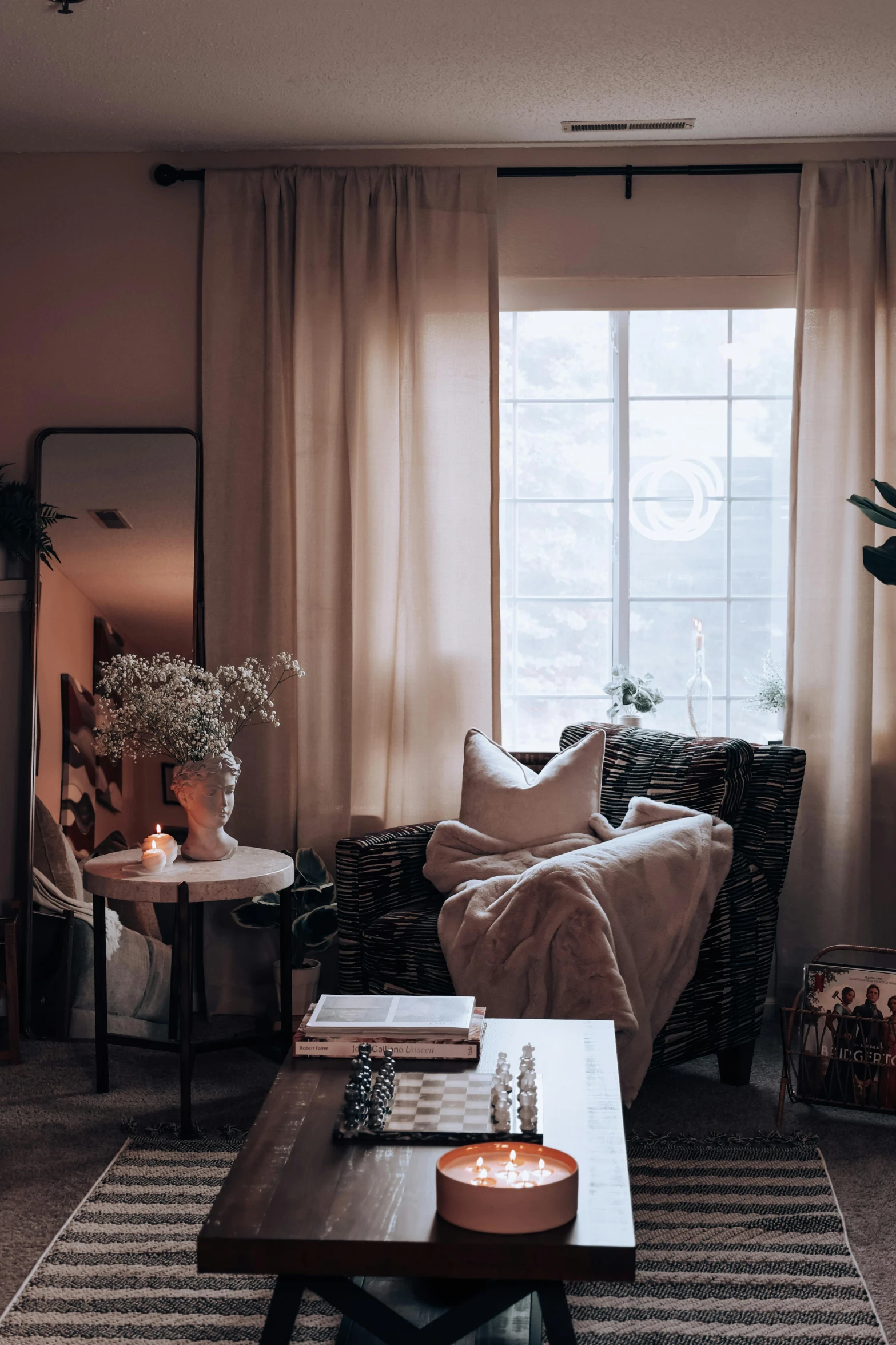 this living room has a table with candles in it