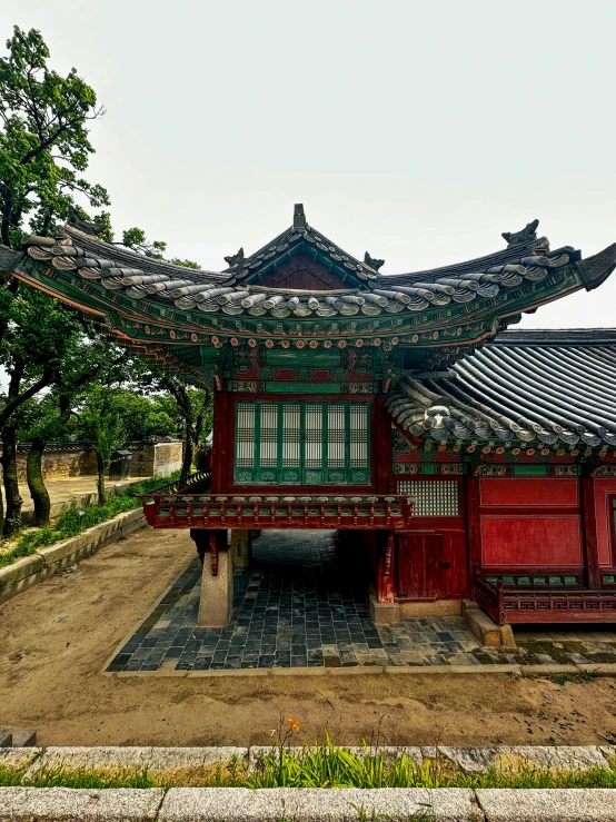 a pagoda building stands near many trees