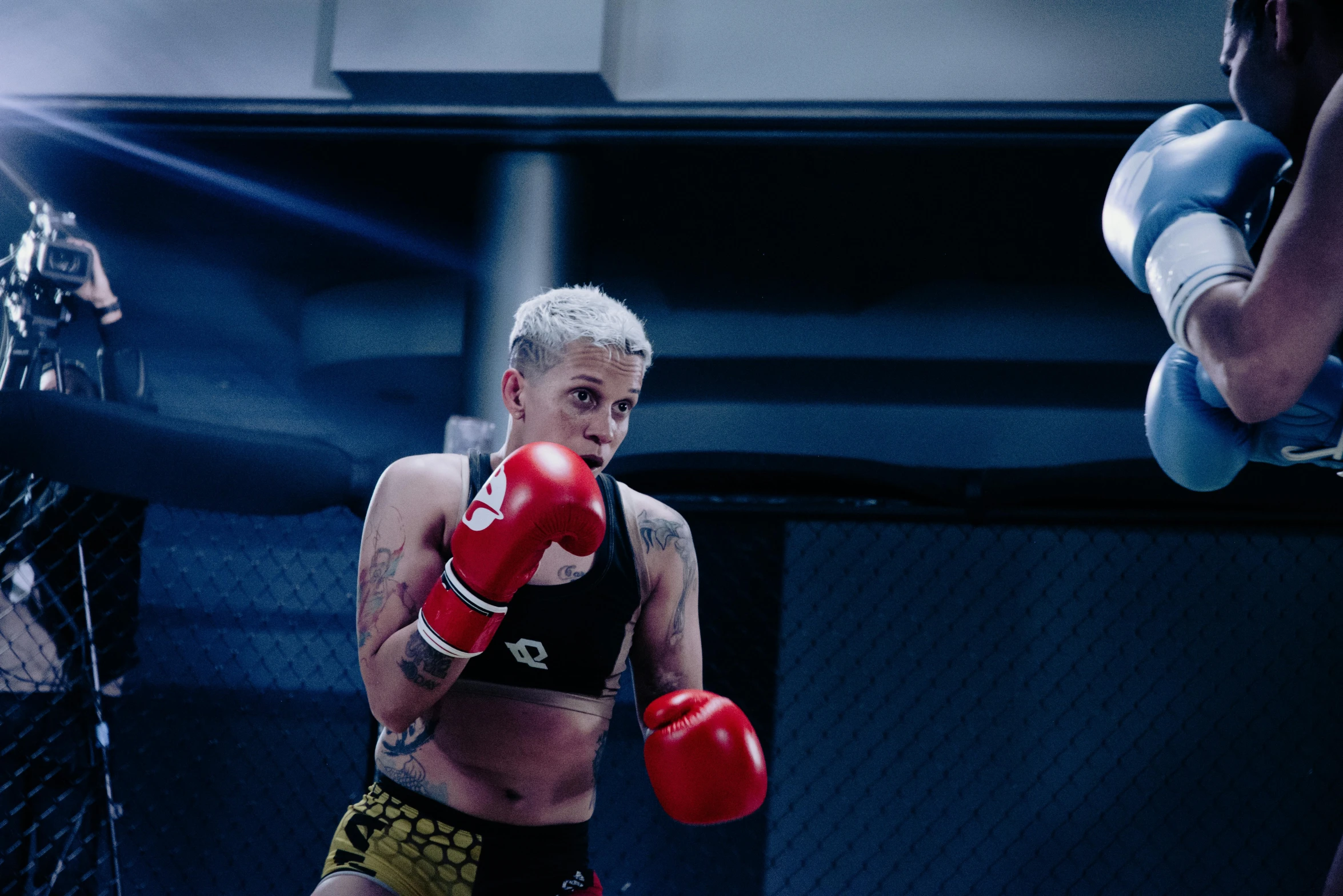 female boxers getting ready to fight in ring