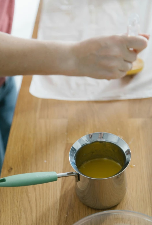 a person has tea in a tea pot