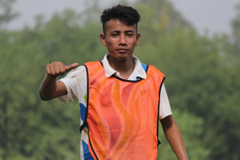 a young man is throwing a frisbee during a game