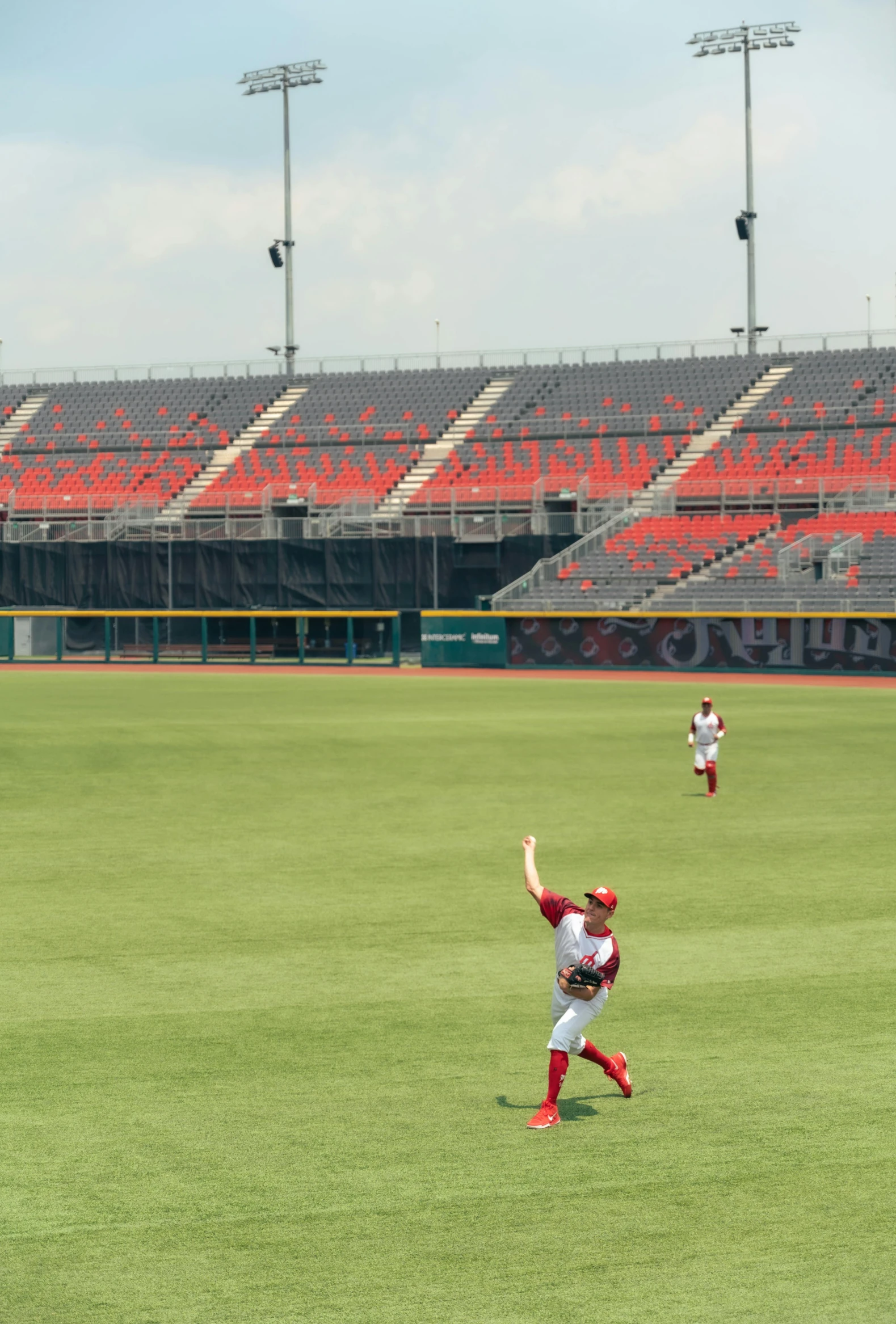 a young baseball player running across the field