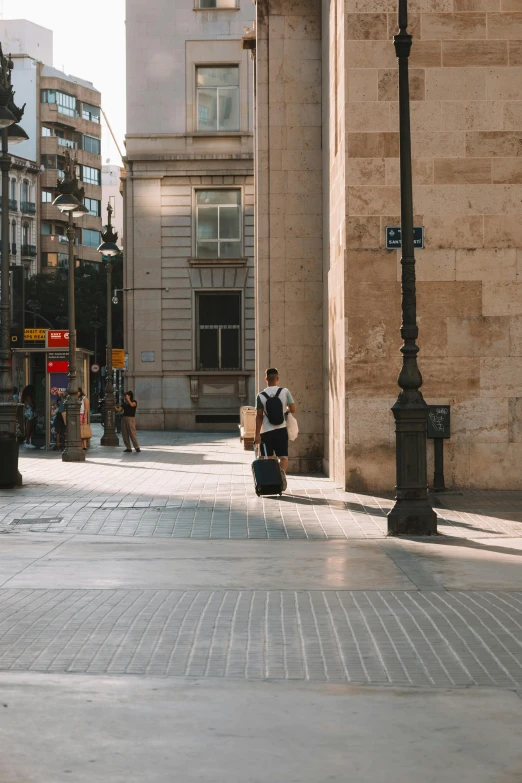 some people are walking along the side walk