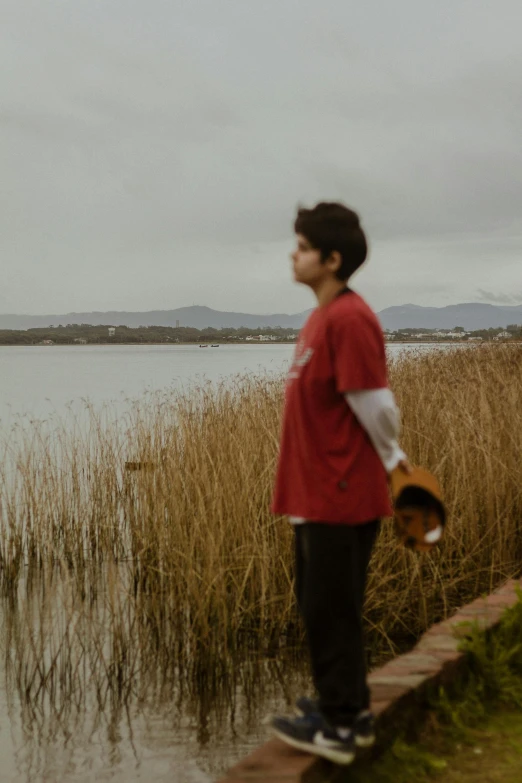 a person standing near a body of water