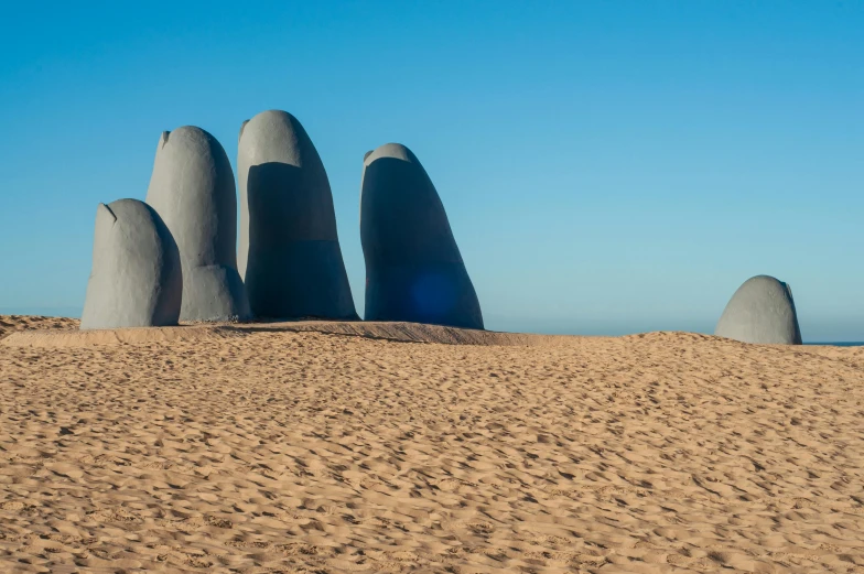 four large rocks stand out among the desert