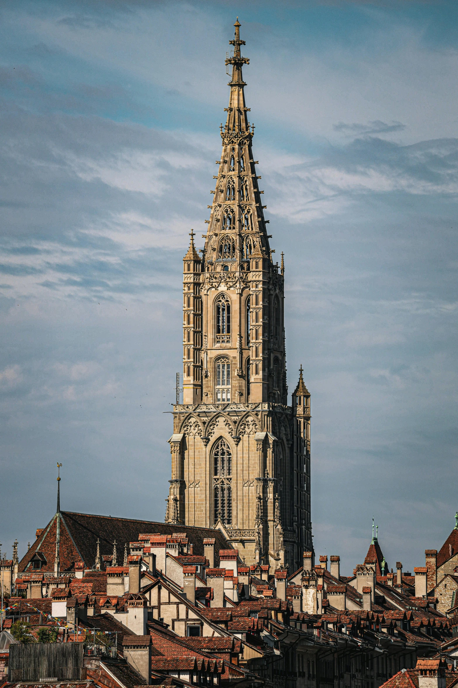 large cathedral on top of some buildings with very tall spires