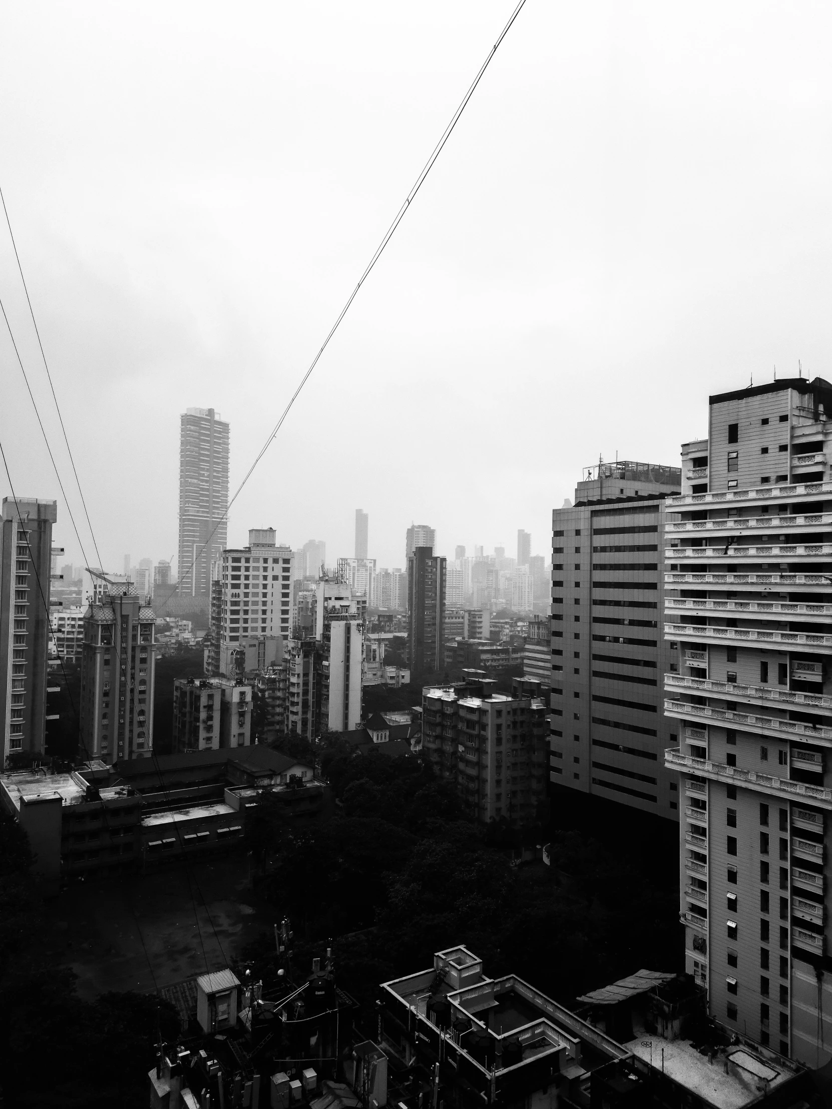 four jets flying over the city with buildings