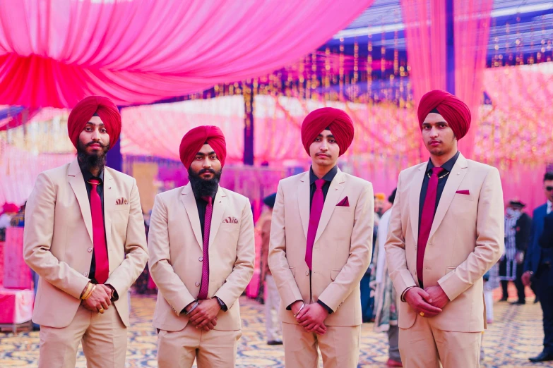 an indian groom and his groomsmen are dressed up in turbans