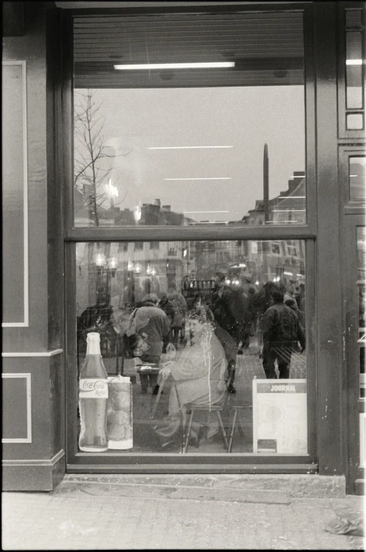 a person looking into the window with a horse and rider