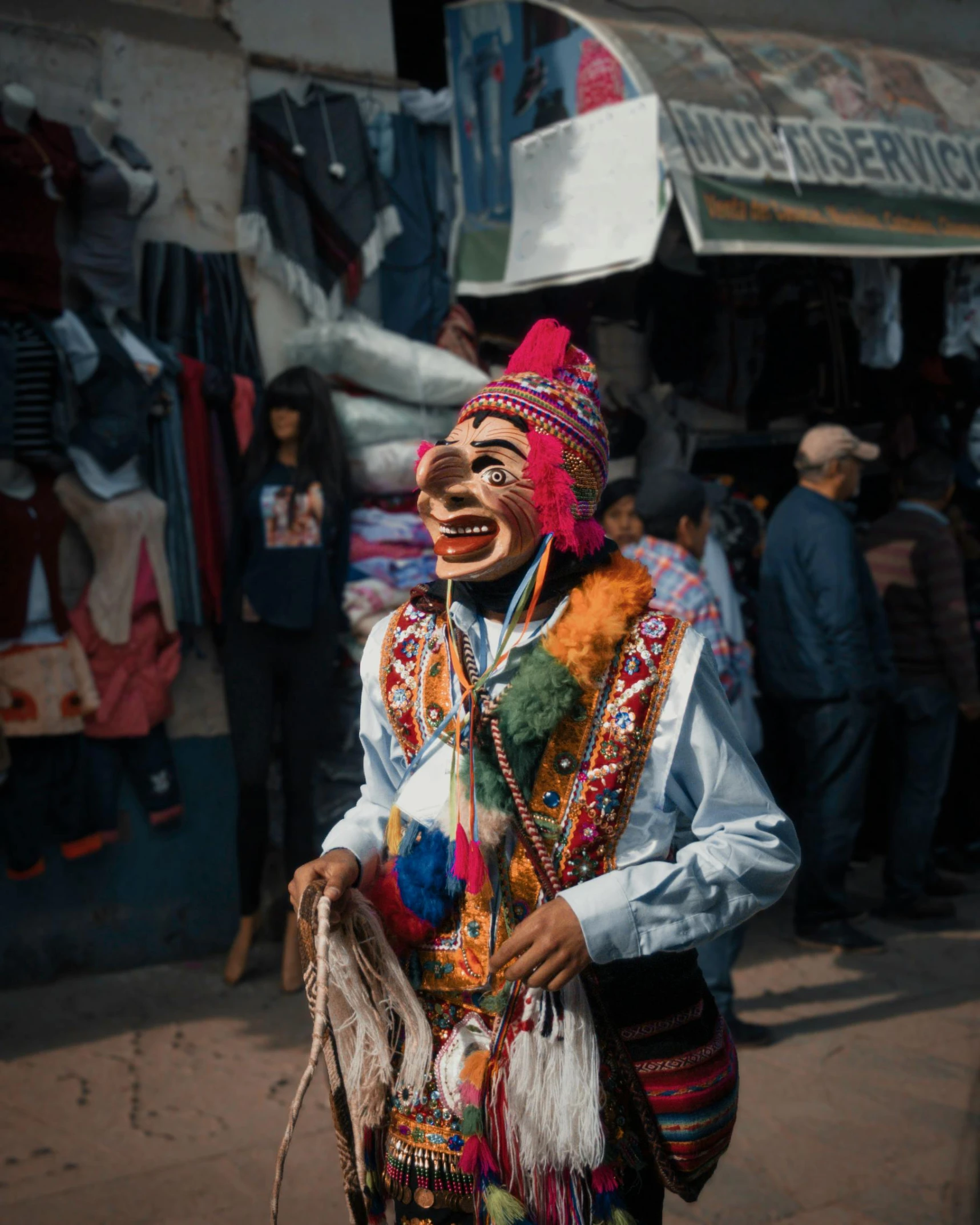 people wearing costumes, one of which has a big grin