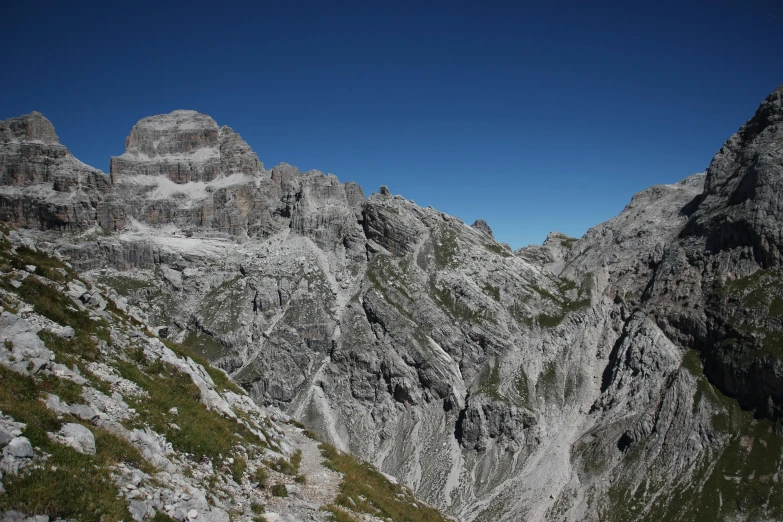 a tall mountain with lots of snow on the top