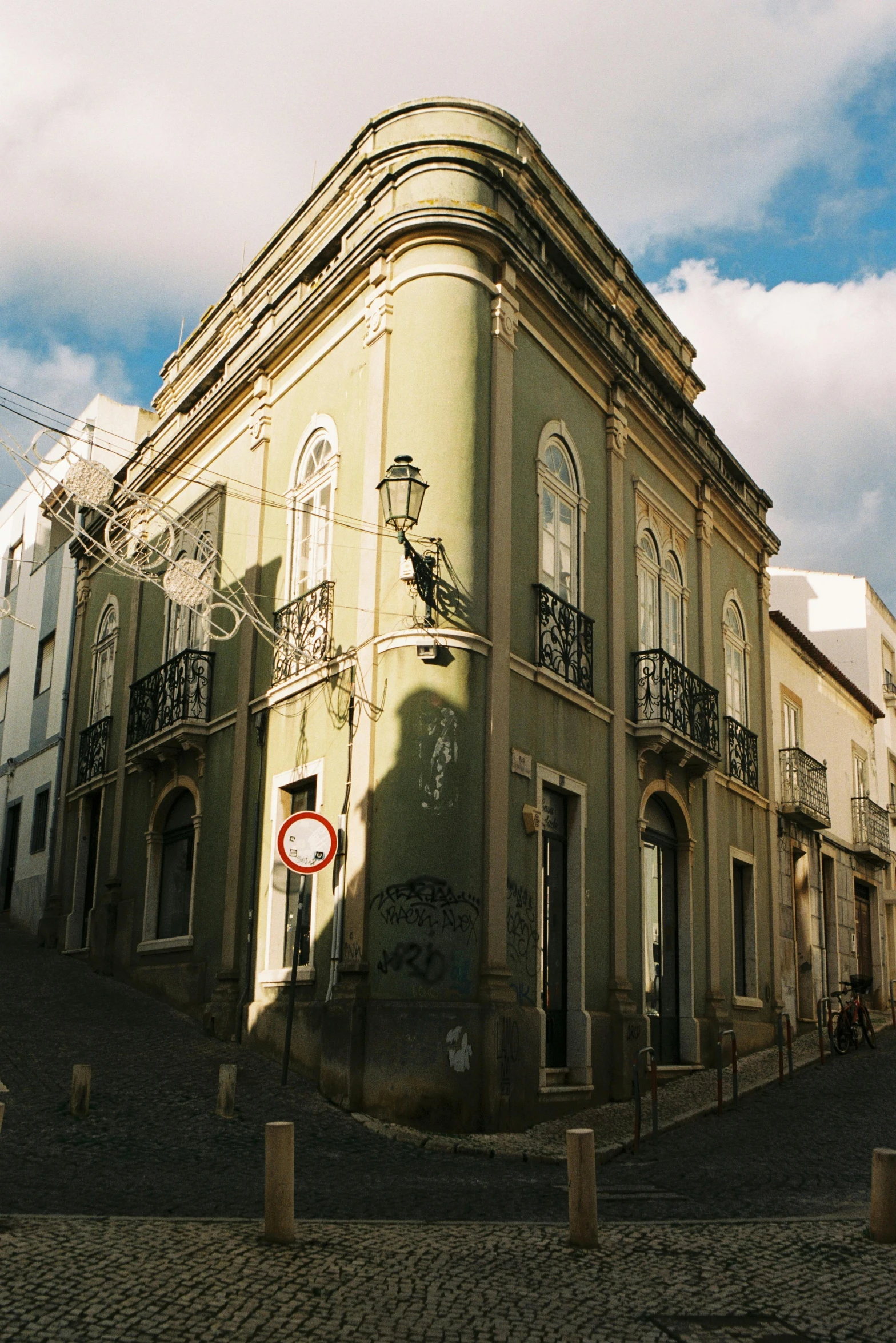 a large building with lots of windows and balconies on the top