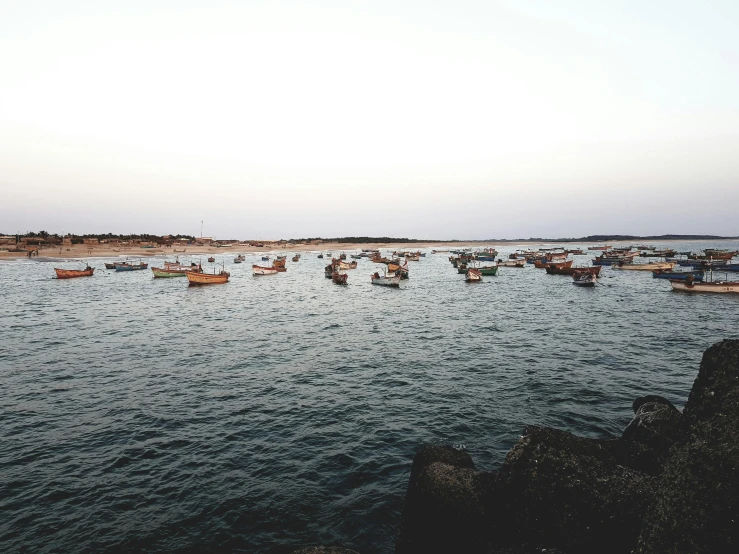 large body of water filled with lots of boats