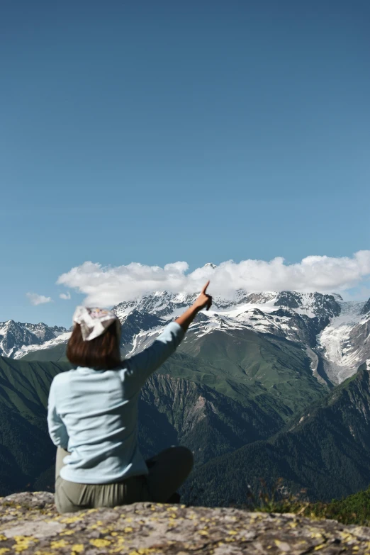 the person is flying a kite in the sky