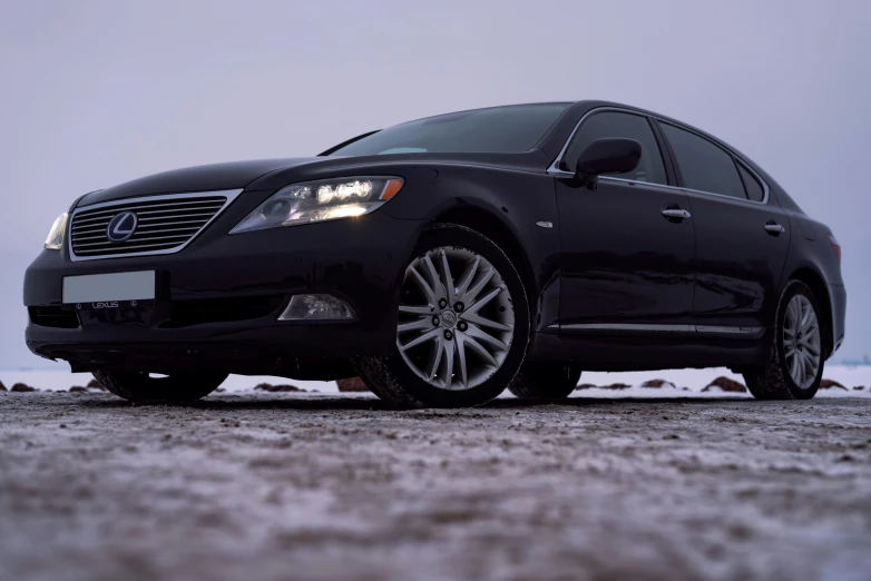 black car on the side of the road in snow