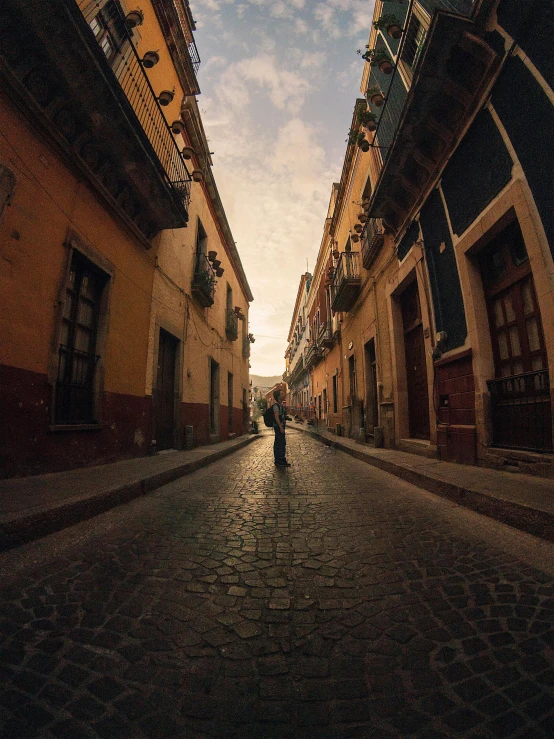 an old street with someone standing on it