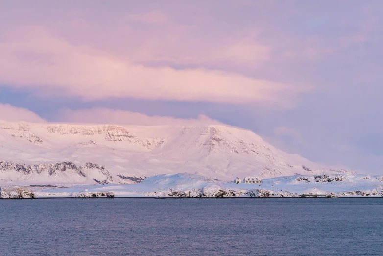 the large white mountains are covered in snow