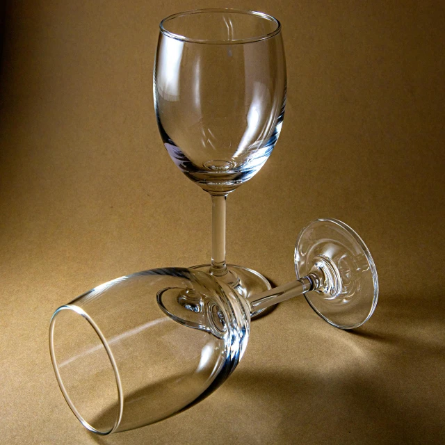 a wine glass with one in the middle next to it