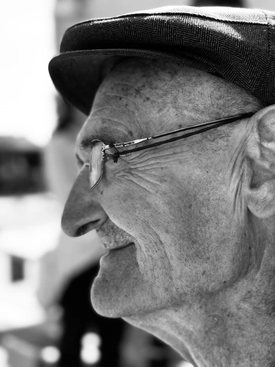 a black and white pograph of a man with a hat on