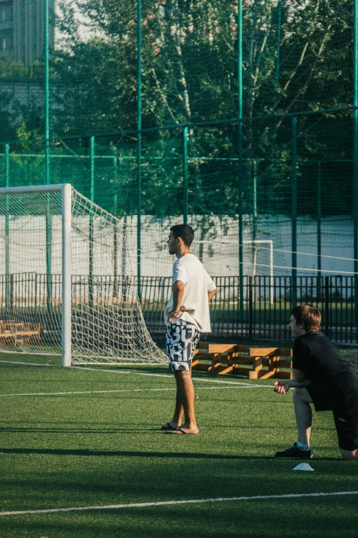 two boys on a field playing a game