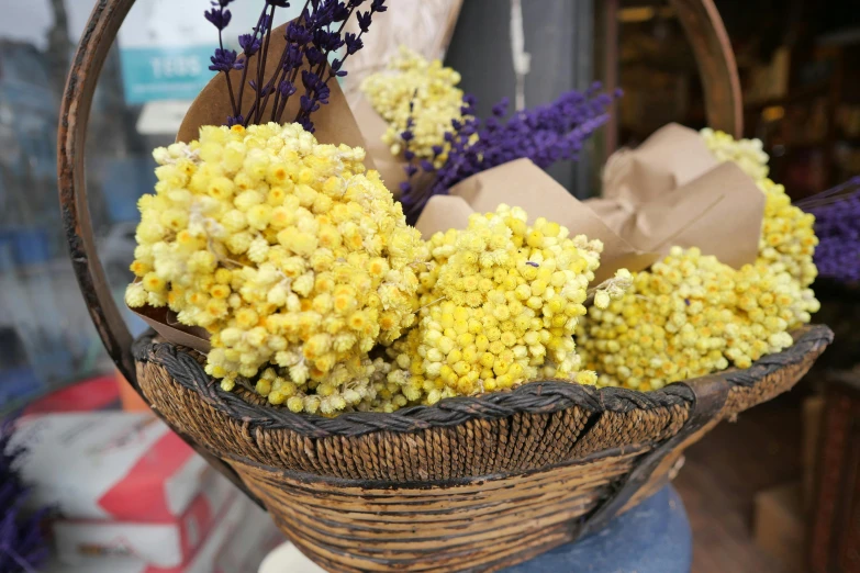 dried flowers in a basket on display outside