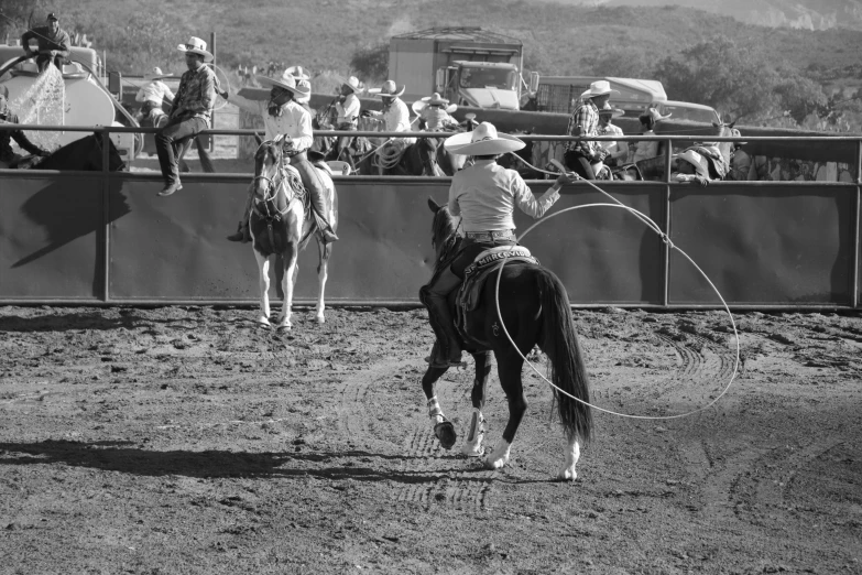 a cowboy that is riding on a horse