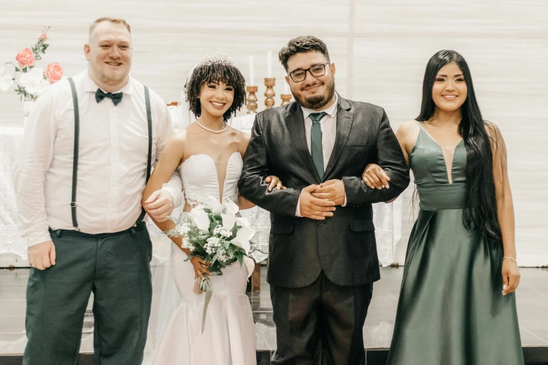 an image of three people standing with their arms around each other