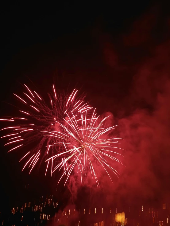 fireworks in the night sky with lots of light up