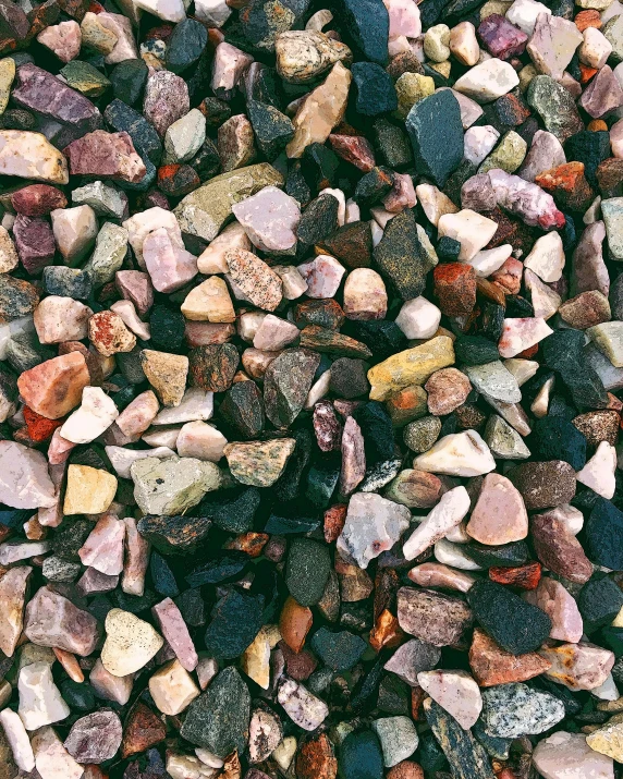 a pile of stones and rocks that is colorful