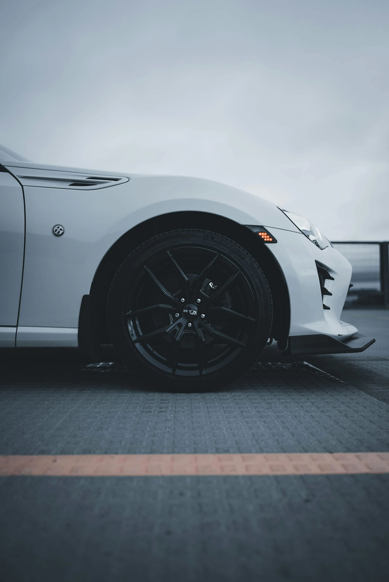 white sports car on a city street