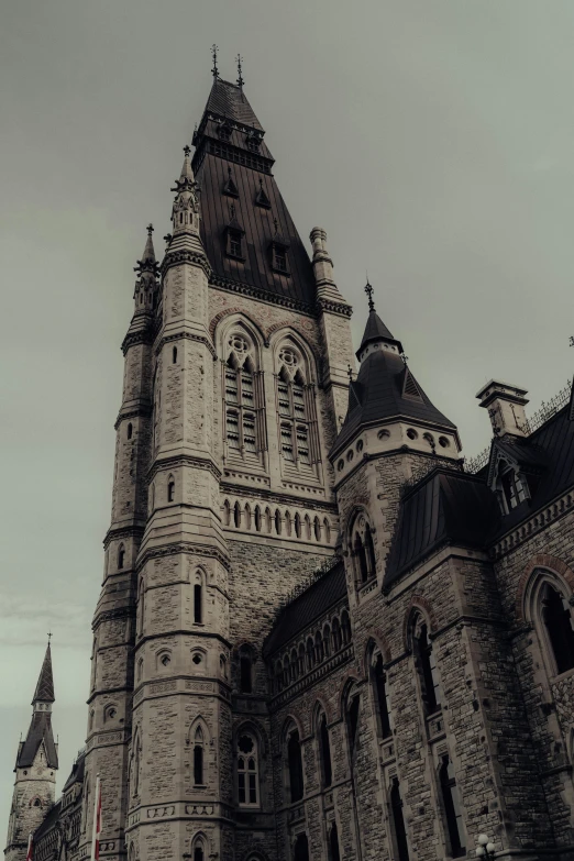 a tall stone cathedral towering over a city