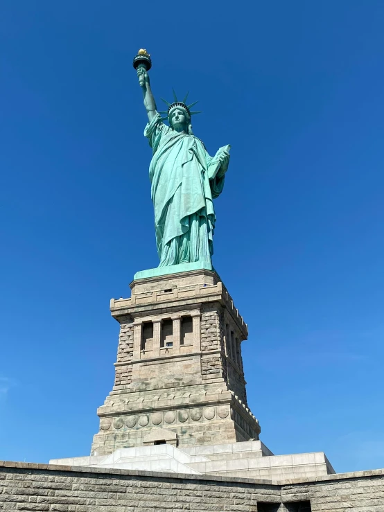 a close up of a very tall statue of liberty