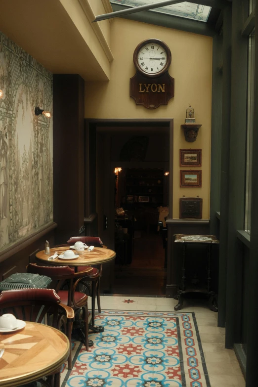 the view inside of a restaurant with tables and chairs