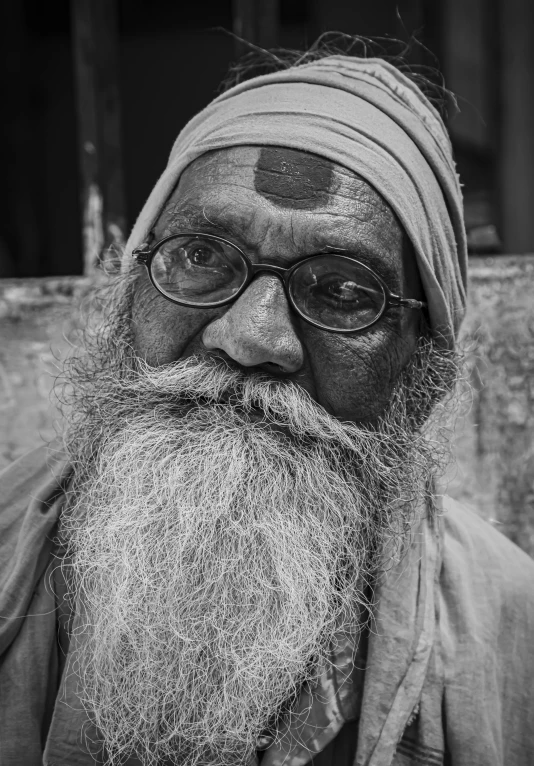 a man with a big white beard wearing glasses