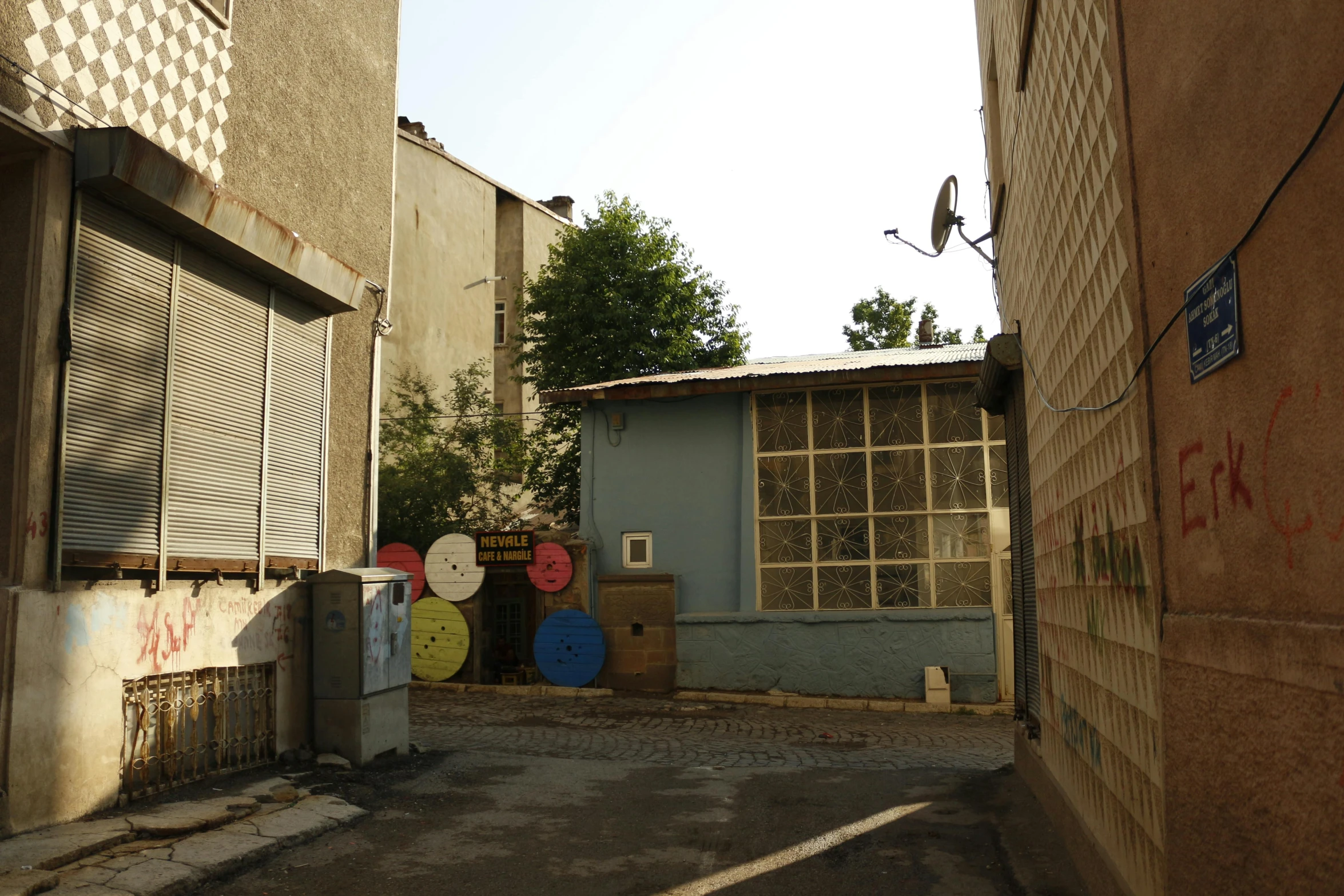 the view of a narrow alleyway from another building