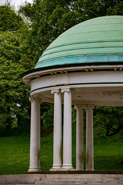 the dome of a white structure with columns on each side