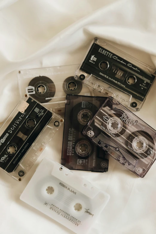 the cassette tapes are sitting next to each other on the bed