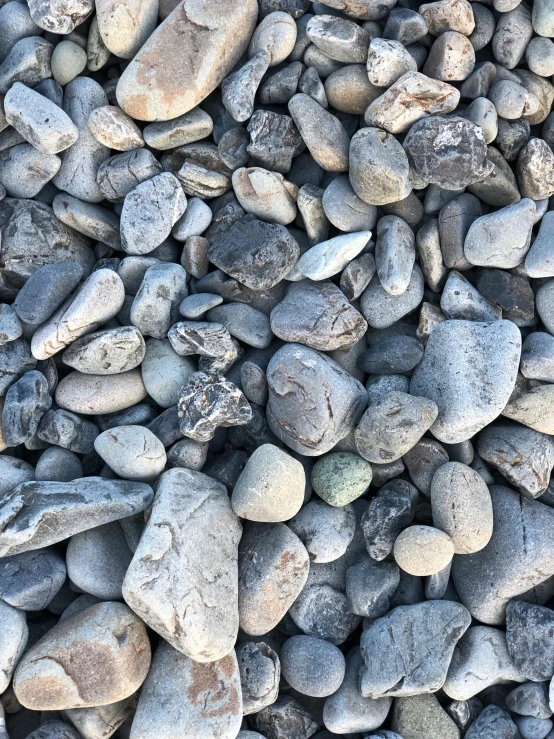 many small rocks and stones sit together