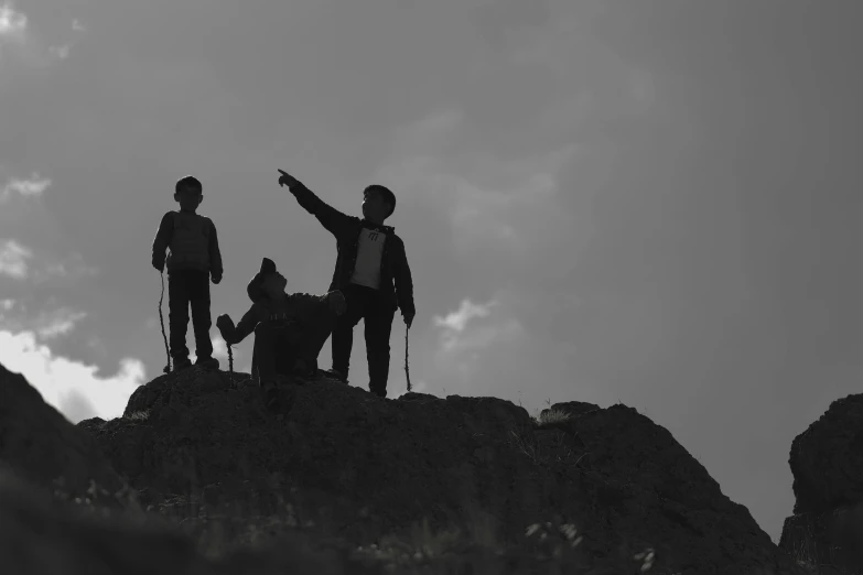 two people standing on top of a mountain