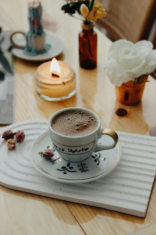 the beverage is sitting on the table on a saucer