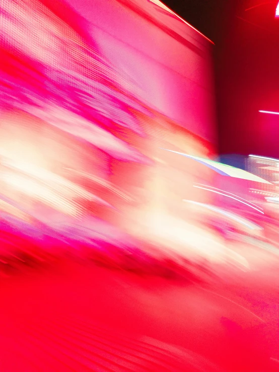 motion blur pograph of person walking on red carpet